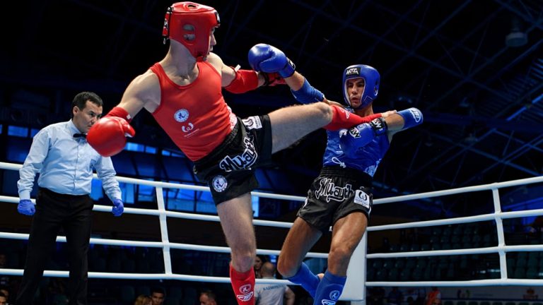 Two fighters competing in a Muay Thai bout at the Muaythai World Championships 2023.